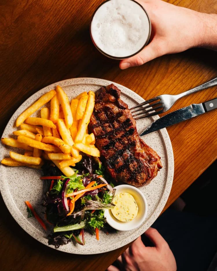 $25 Porterhouse Steak Night | Happy Hour Drinks & Specials